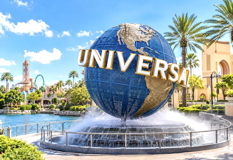 The Universal Orlando globe with palm trees behind it