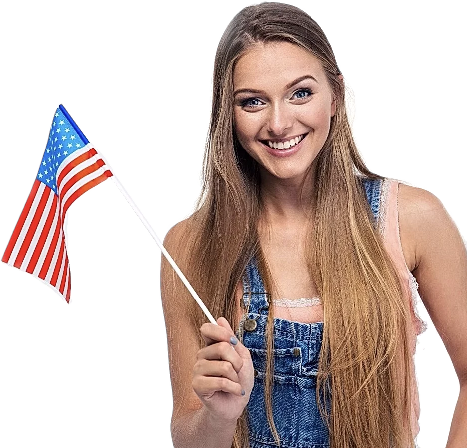 Smiling student holding an American flag